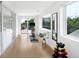 Bright home gym offers wood floors, weights, stationary bike, and sliding glass doors to the outside at 2242 W 34Th Ave, Denver, CO 80211