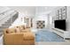 Comfortable living room with contemporary furnishings and easy access to stairwell at 2242 W 34Th Ave, Denver, CO 80211
