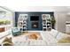 Cozy living room with fireplace, built-in bookshelves, and comfortable seating area at 2242 W 34Th Ave, Denver, CO 80211