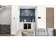 Living room featuring custom bar with wine fridge, blue backsplash, and access to outdoor areas at 2242 W 34Th Ave, Denver, CO 80211