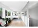 Bright office space with hardwood floors, a large desk, and sliding glass doors at 2242 W 34Th Ave, Denver, CO 80211
