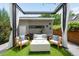Cozy patio with artificial turf, outdoor seating, pergola, fire pit, and garden wall at 2242 W 34Th Ave, Denver, CO 80211