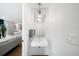 Clean powder room with floating vanity, mirror, pendant light, and view to living areas at 2242 W 34Th Ave, Denver, CO 80211