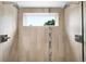Contemporary shower features dual shower heads, tile walls, and a built in window at 2242 W 34Th Ave, Denver, CO 80211