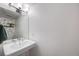 Half bathroom featuring modern fixtures, vanity, and decor at 6435 S Dayton St # 103, Englewood, CO 80111