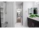 Hallway leading to the bathroom and the custom walk-in closet with ample storage space at 6435 S Dayton St # 103, Englewood, CO 80111