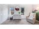 Bedroom with natural light, dresser, and a comfortable armchair at 6435 S Dayton St # 103, Englewood, CO 80111