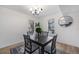 Cozy dining area with modern chandelier, seating for four and large windows at 6435 S Dayton St # 103, Englewood, CO 80111