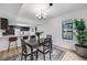 Dining room with backyard views and open to the kitchen at 6435 S Dayton St # 103, Englewood, CO 80111