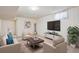 Finished basement area with neutral decor, plush seating, and ample space for entertaining or relaxing at 1687 S Field Ct, Lakewood, CO 80232