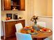Cozy dining area with a wooden table, seating for four, and stylish decor at 1687 S Field Ct, Lakewood, CO 80232