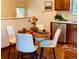 Dining area with seating for four, next to the kitchen with stainless steel dishwasher at 1687 S Field Ct, Lakewood, CO 80232