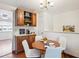 Cozy dining area featuring wood floors and a built-in buffet with a coffee and beverage station at 1687 S Field Ct, Lakewood, CO 80232