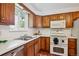 Kitchen with stainless steel dishwasher, and white appliances at 1687 S Field Ct, Lakewood, CO 80232