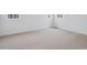 Spacious bedroom with plush carpeting and bright windows, creating a cozy retreat at 45928 Gentry Ave, Bennett, CO 80102