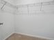 Walk-in closet with wire shelving ready to organize your belongings at 45928 Gentry Ave, Bennett, CO 80102