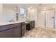 Bathroom with a dual vanity and a glass-enclosed walk-in shower with neutral finishes at 4586 Windmill Dr, Brighton, CO 80601