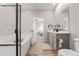 Beautiful bathroom with dual sink vanity, soaking tub, and standing shower at 17801 E 95Th Pl, Commerce City, CO 80022