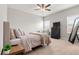 Bedroom with full bed, nightstand, and dresser next to the window at 17801 E 95Th Pl, Commerce City, CO 80022