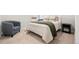 Bedroom with comfortable seating and large bed with decorative pillows at 17801 E 95Th Pl, Commerce City, CO 80022