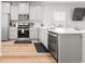 Bright kitchen with modern appliances, light cabinets, and a stylish backsplash at 17801 E 95Th Pl, Commerce City, CO 80022