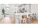 Modern kitchen with white countertops, stainless steel appliances, and bar seating at 17801 E 95Th Pl, Commerce City, CO 80022