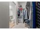 Large walk-in closet with shelving and hanging racks at 17801 E 95Th Pl, Commerce City, CO 80022