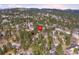 Aerial view of house and neighborhood in winter at 3028 Olympia Cir, Evergreen, CO 80439