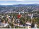 Aerial view of house and neighborhood in winter at 3028 Olympia Cir, Evergreen, CO 80439