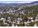 Wide aerial view of home and mountainous neighborhood at 3028 Olympia Cir, Evergreen, CO 80439