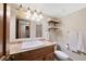 Basement bathroom with single vanity and shower at 3028 Olympia Cir, Evergreen, CO 80439