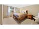 Basement bedroom with double bed and wood furniture at 3028 Olympia Cir, Evergreen, CO 80439