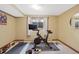 Basement fitness area with stationary bike and weights at 3028 Olympia Cir, Evergreen, CO 80439