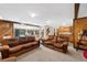 Basement Gathering room with wet bar and comfortable seating at 3028 Olympia Cir, Evergreen, CO 80439