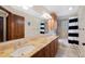 Bathroom with double sinks and granite countertops at 3028 Olympia Cir, Evergreen, CO 80439