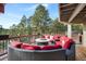 Relaxing deck with fire pit and comfortable seating for outdoor enjoyment at 3028 Olympia Cir, Evergreen, CO 80439