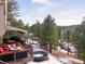 Large deck with mountain views and seating area at 3028 Olympia Cir, Evergreen, CO 80439