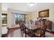 Elegant dining room with hardwood floors and large windows at 3028 Olympia Cir, Evergreen, CO 80439