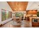 Bright kitchen with wood cabinets, granite island, and stainless steel appliances at 3028 Olympia Cir, Evergreen, CO 80439