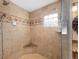 Spacious shower with a built-in seat and glass enclosure at 3028 Olympia Cir, Evergreen, CO 80439