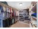 Large walk-in closet with ample shelving and hanging space at 3028 Olympia Cir, Evergreen, CO 80439