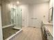 Contemporary bathroom with glass enclosed shower, double sinks, and modern fixtures at 3966 Doubletrack Ln, Castle Rock, CO 80108
