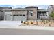 Beautiful stone and siding exterior with a well-manicured front yard and attached two car garage at 3966 Doubletrack Ln, Castle Rock, CO 80108