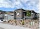 Attractive home with stone accents, a welcoming front porch, and low maintenance landscaping at 3966 Doubletrack Ln, Castle Rock, CO 80108