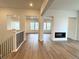Bright living space featuring a modern fireplace and lots of natural light at 3966 Doubletrack Ln, Castle Rock, CO 80108