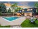 Gorgeous backyard oasis with a sparkling pool, patio area, and modern home design at 1440 S Dahlia St, Denver, CO 80222