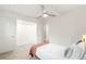 Bright bedroom featuring hardwood floors, closet and windows to the backyard at 1440 S Dahlia St, Denver, CO 80222