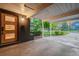 Covered carport showcasing a unique door and convenient access to the home's entry at 1440 S Dahlia St, Denver, CO 80222
