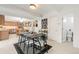 Bright dining room with modern furnishings near stairs, kitchen, and bathroom at 1440 S Dahlia St, Denver, CO 80222