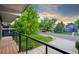 Street view from a porch showing the landscaped yard and an exterior home at 1440 S Dahlia St, Denver, CO 80222
